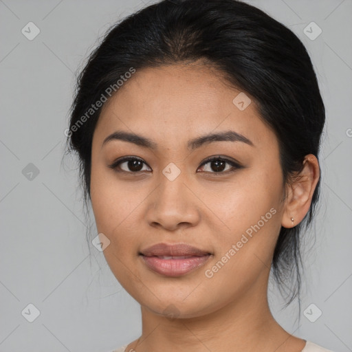 Joyful asian young-adult female with medium  black hair and brown eyes