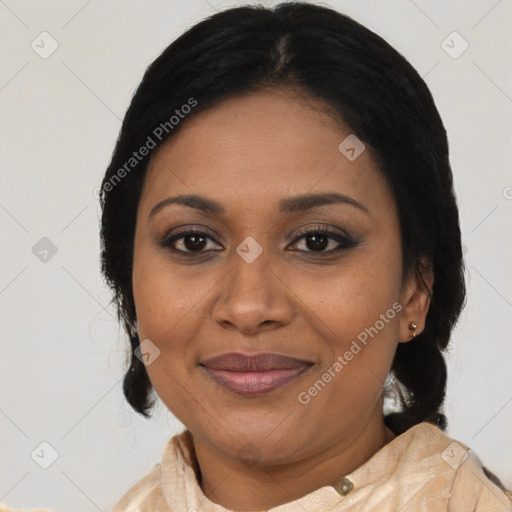 Joyful black adult female with medium  brown hair and brown eyes