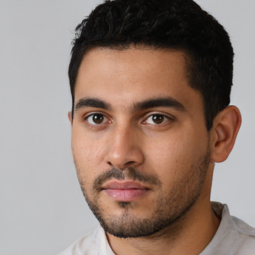 Neutral latino young-adult male with short  black hair and brown eyes