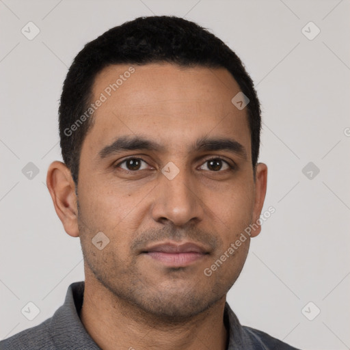 Neutral latino young-adult male with short  black hair and brown eyes