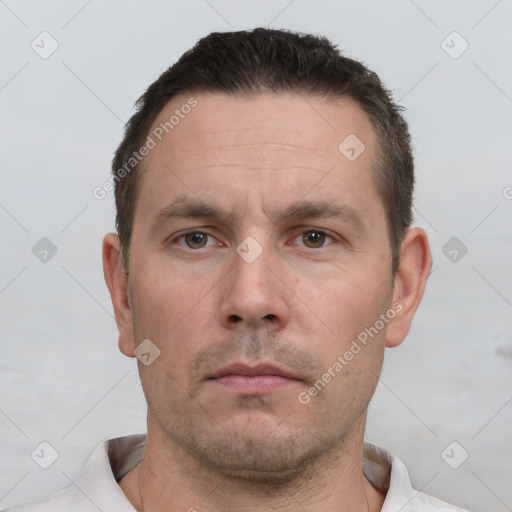 Neutral white adult male with short  brown hair and brown eyes