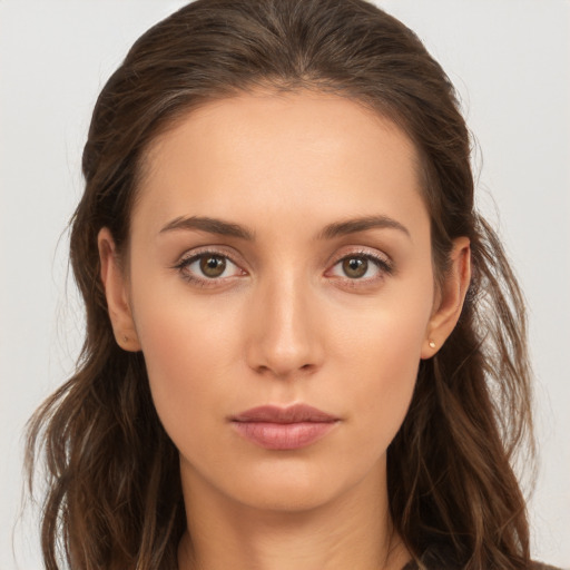 Neutral white young-adult female with long  brown hair and brown eyes