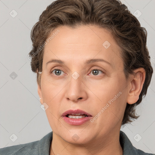 Joyful white adult female with short  brown hair and grey eyes