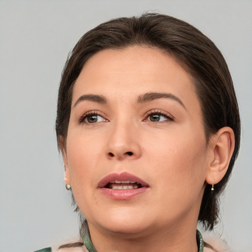 Joyful white young-adult female with medium  brown hair and brown eyes