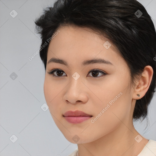 Joyful asian young-adult female with medium  black hair and brown eyes