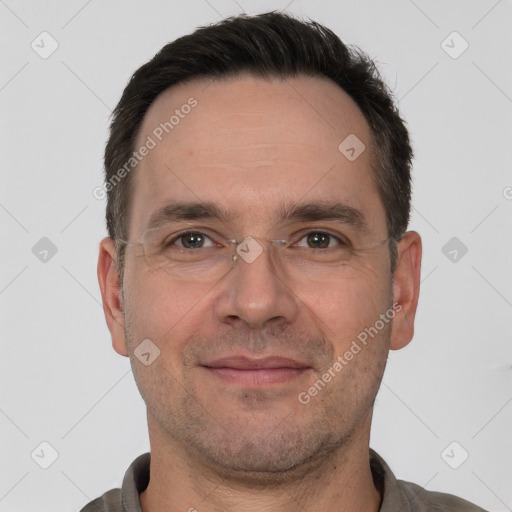 Joyful white adult male with short  brown hair and brown eyes