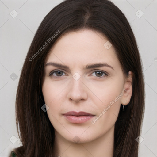 Neutral white young-adult female with long  brown hair and brown eyes