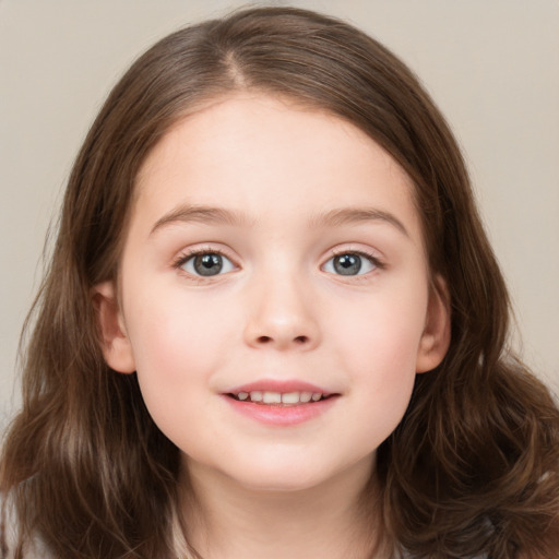 Joyful white child female with long  brown hair and grey eyes