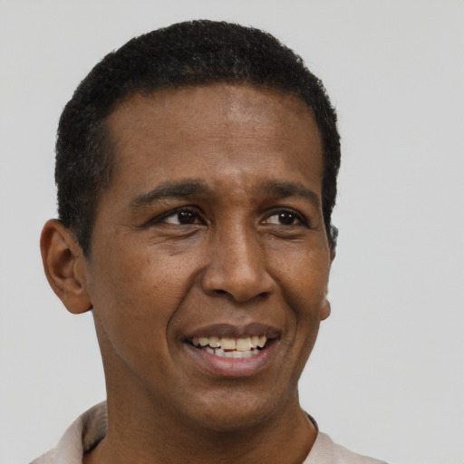 Joyful black young-adult male with short  black hair and brown eyes