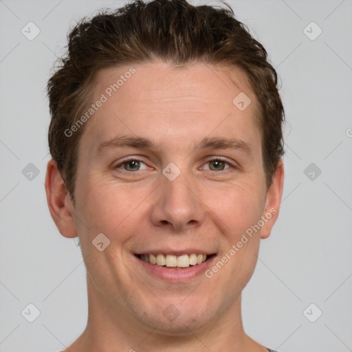 Joyful white adult male with short  brown hair and grey eyes