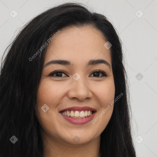 Joyful asian young-adult female with long  brown hair and brown eyes