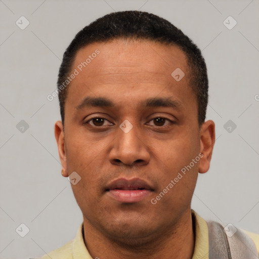 Neutral latino young-adult male with short  black hair and brown eyes