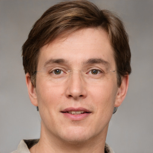 Joyful white adult male with short  brown hair and grey eyes