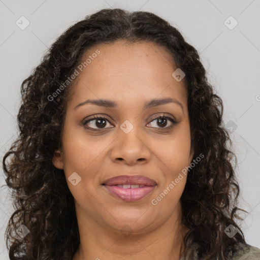 Joyful black young-adult female with long  brown hair and brown eyes