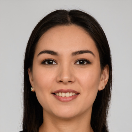 Joyful white young-adult female with long  brown hair and brown eyes