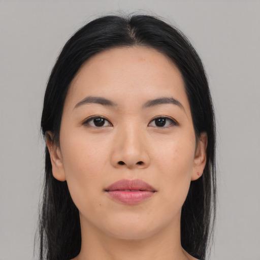 Joyful asian young-adult female with long  black hair and brown eyes
