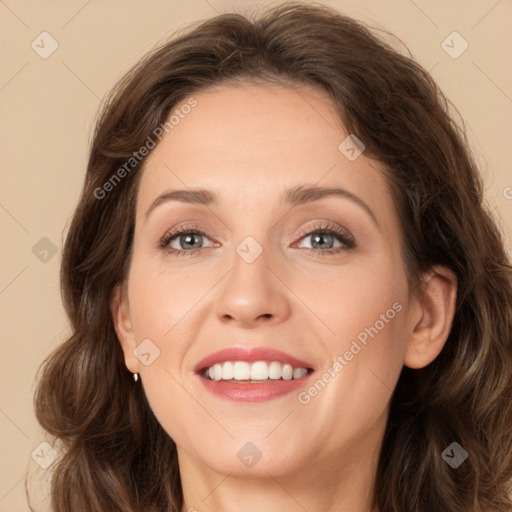 Joyful white young-adult female with long  brown hair and green eyes