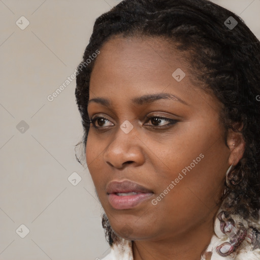 Joyful black young-adult female with medium  black hair and brown eyes