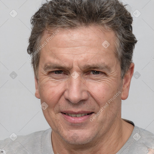 Joyful white middle-aged male with short  brown hair and brown eyes