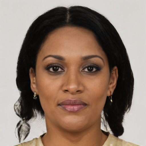 Joyful black young-adult female with medium  black hair and brown eyes