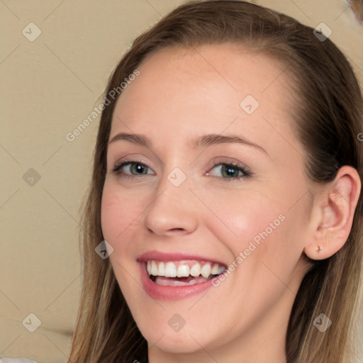 Joyful white young-adult female with long  brown hair and blue eyes