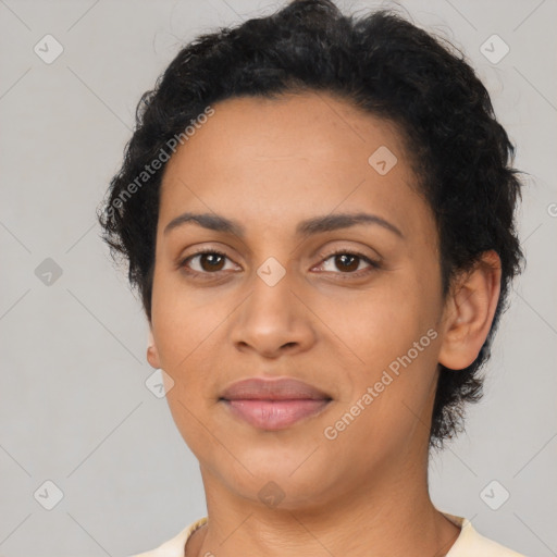 Joyful latino young-adult female with short  black hair and brown eyes