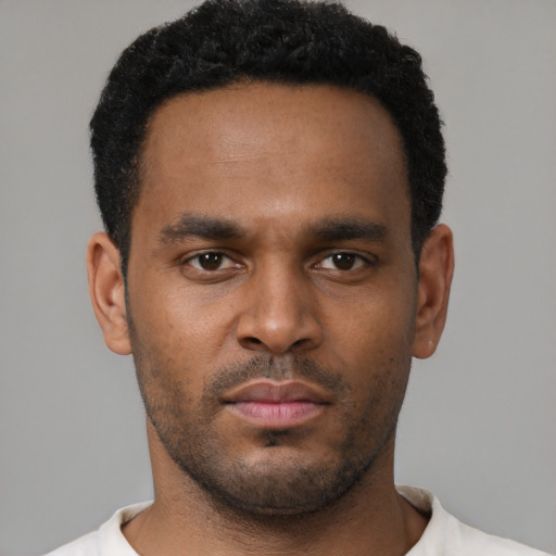 Neutral black young-adult male with short  black hair and brown eyes