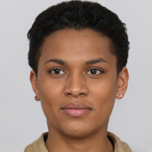 Joyful black young-adult female with short  brown hair and brown eyes