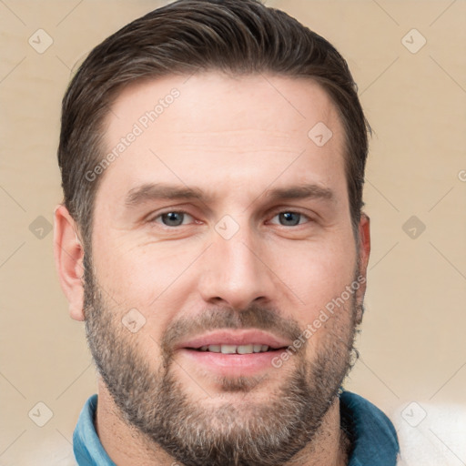 Joyful white adult male with short  brown hair and brown eyes