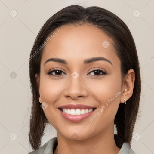 Joyful latino young-adult female with medium  brown hair and brown eyes