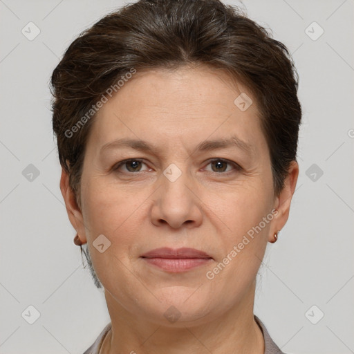 Joyful white adult female with short  brown hair and brown eyes