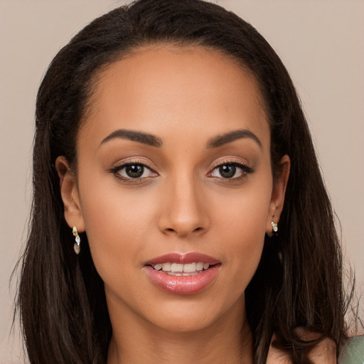 Joyful white young-adult female with long  brown hair and brown eyes