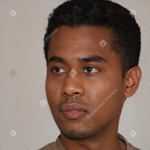 Neutral black young-adult male with short  black hair and brown eyes