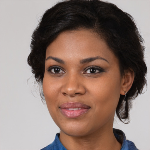 Joyful black young-adult female with medium  brown hair and brown eyes