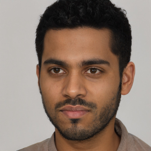 Neutral latino young-adult male with short  black hair and brown eyes