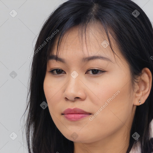 Joyful asian young-adult female with long  brown hair and brown eyes