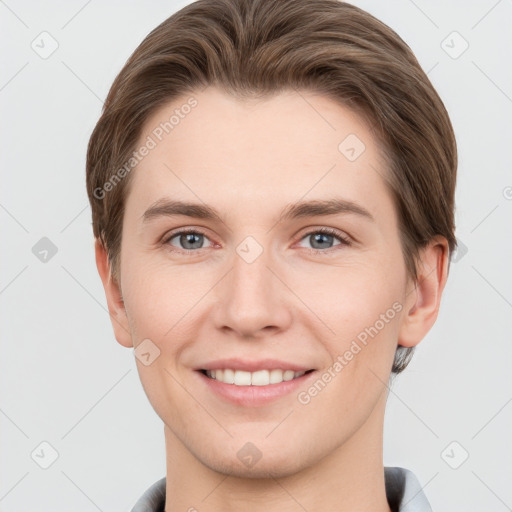 Joyful white young-adult female with short  brown hair and grey eyes