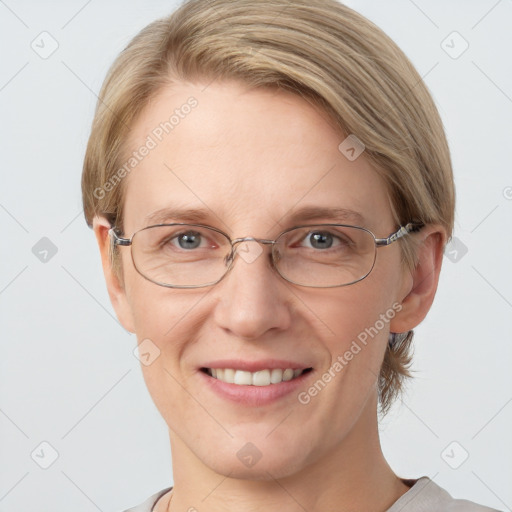 Joyful white adult female with short  brown hair and grey eyes