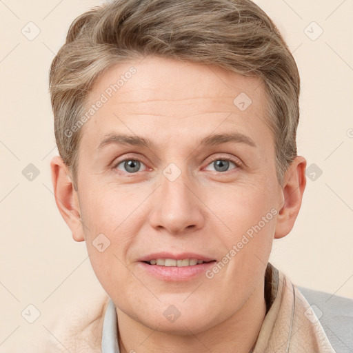 Joyful white adult male with short  brown hair and grey eyes