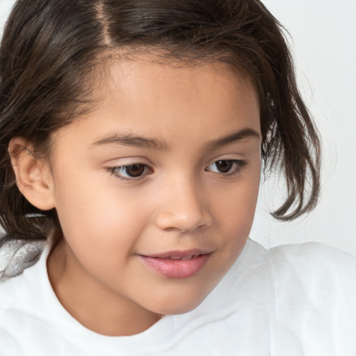 Joyful white child female with medium  brown hair and brown eyes