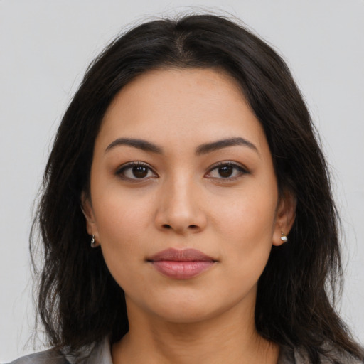 Neutral latino young-adult female with long  brown hair and brown eyes