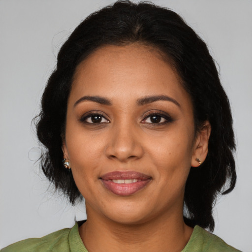 Joyful latino young-adult female with medium  black hair and brown eyes