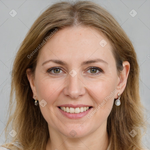 Joyful white adult female with long  brown hair and brown eyes