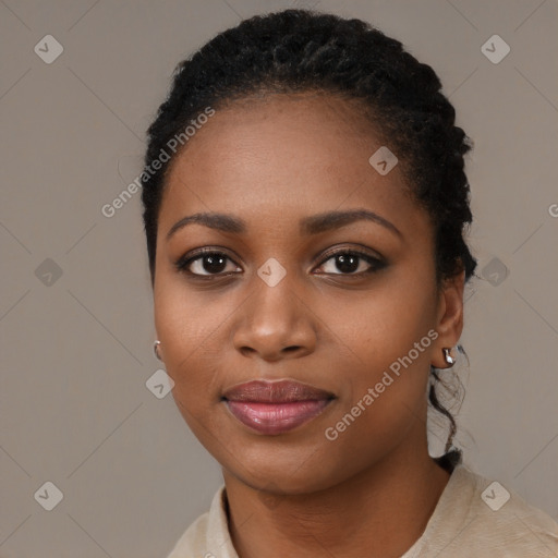 Joyful black young-adult female with short  black hair and brown eyes