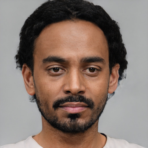 Neutral black young-adult male with short  black hair and brown eyes