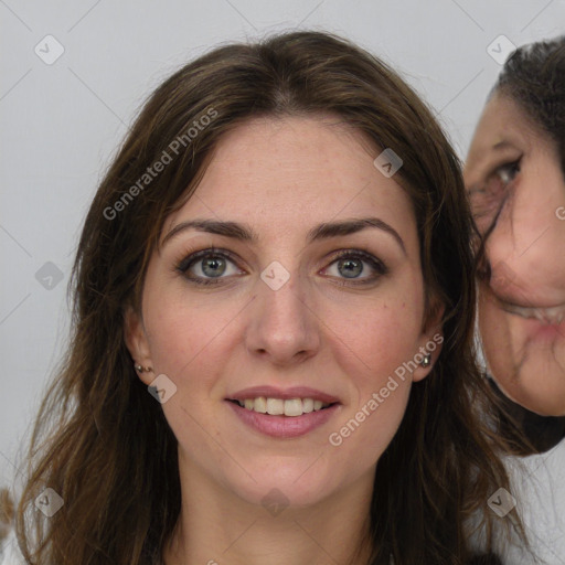 Joyful white young-adult female with medium  brown hair and grey eyes