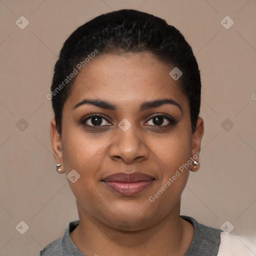 Joyful black young-adult female with short  black hair and brown eyes