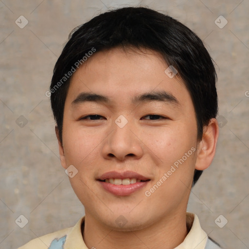 Joyful asian young-adult male with short  black hair and brown eyes