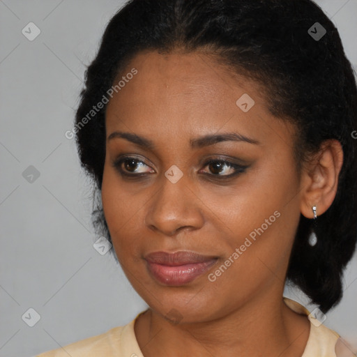 Joyful black young-adult female with short  brown hair and brown eyes