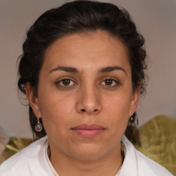 Joyful white adult female with medium  brown hair and brown eyes